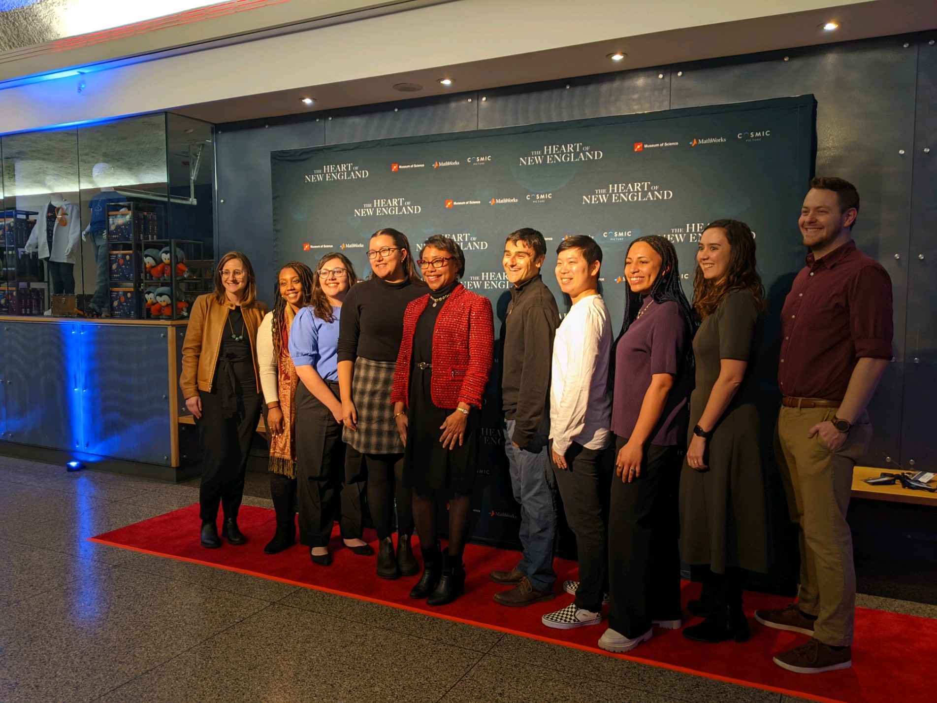 Professor Hammond and some members of the lab pose for a picture on the red carpet at the premiere of "The Heart of New England", which features her story.